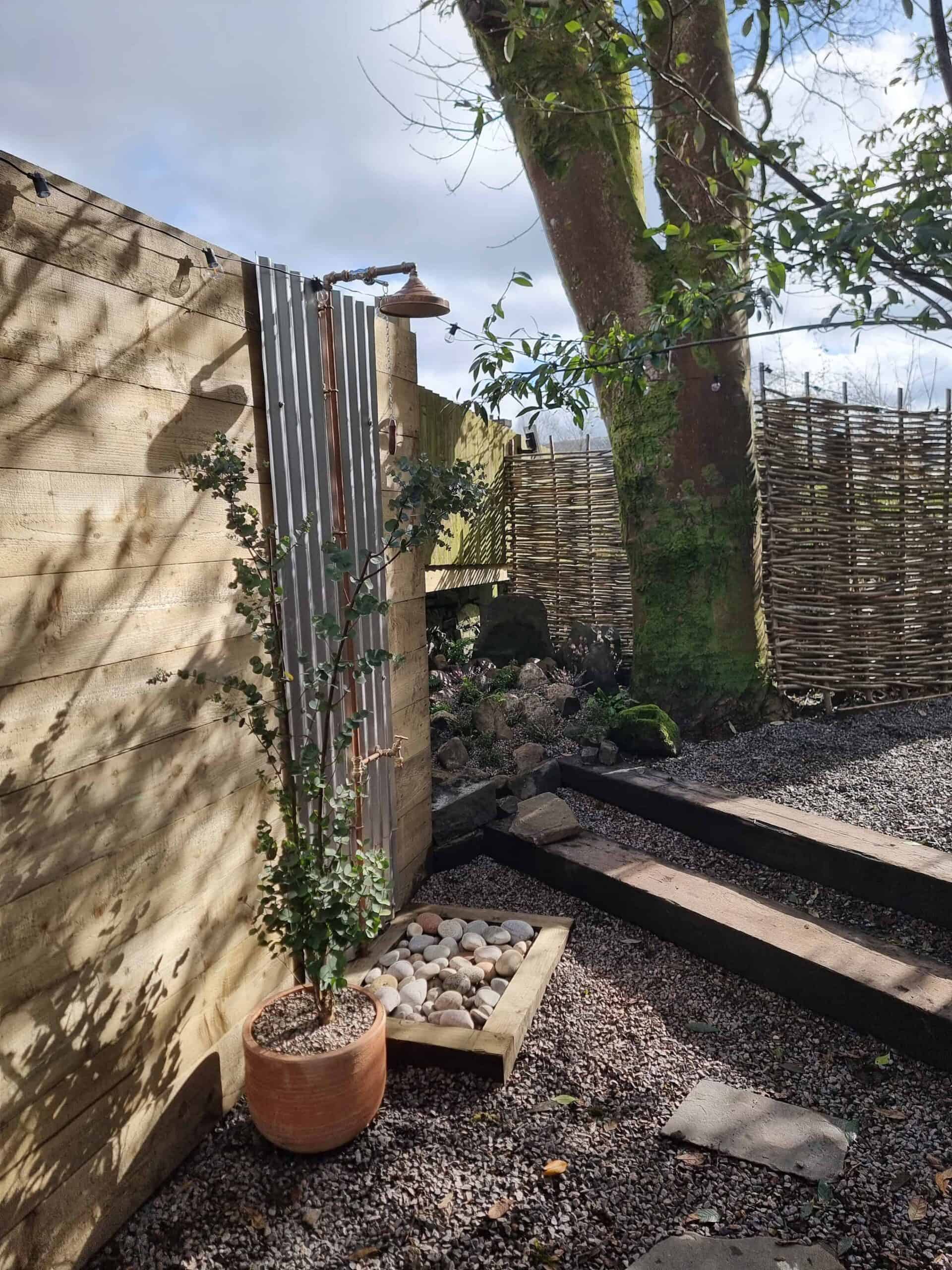 an outdoor shower set up for post sauna cooling off